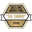 Hexagon-shaped gold and black badge with text: Sales and Marketing The Sammy 2025 inside, and a white ribbon across the middle.